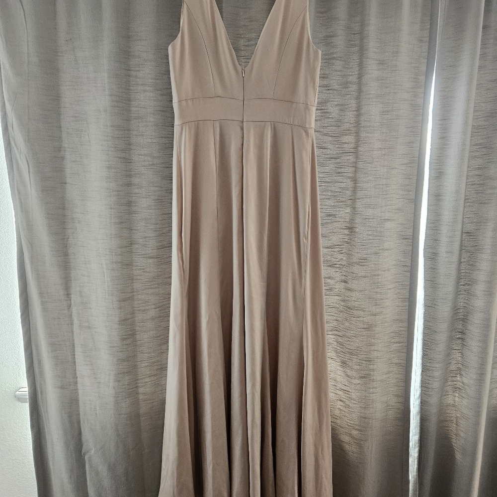 Size 10 Beige bridesmaid dress with a left leg slit. In really great condition w